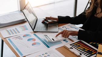 Jewelers of America’s new “Careers in the Jewelry Industry” guide is available online and in print. Stock image of woman on laptop with charts