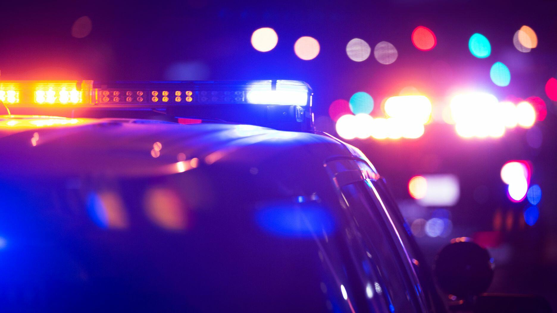 Police are on the lookout for the man and woman who broke into a California jewelry store earlier this month and fled with the store’s safe trailing from their van. Stock image of police cars with their lights on