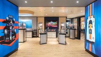 Partnering with Starboard, TAG Heuer developed a sleek, modern interior with imagery that pays homage to the brand’s motorsport heritage. Interior of TAG Heuer Boutique on Carnival Cruise Ship