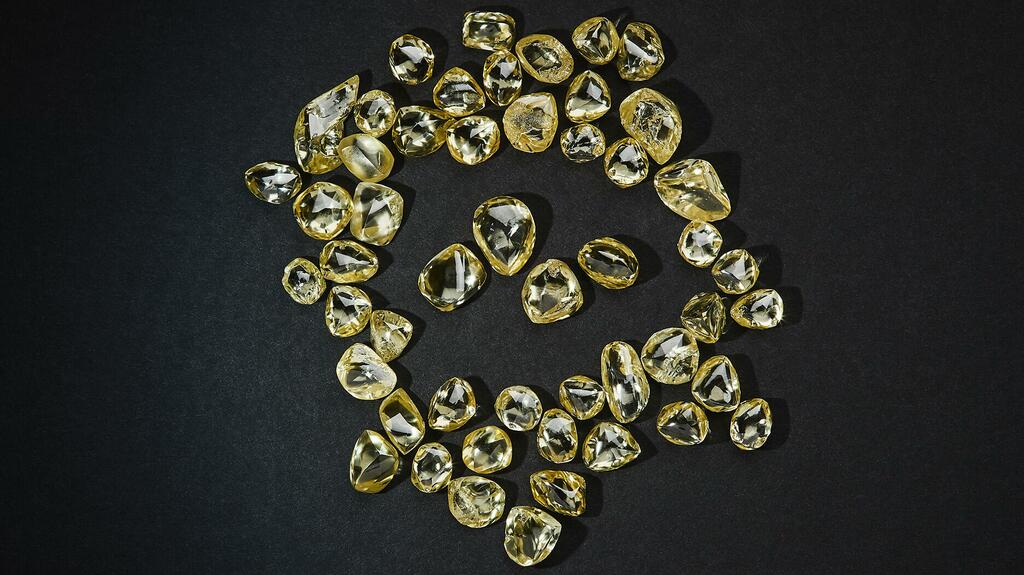 Rough yellow diamonds from Ellendale in Western Australia. Burgundy Diamonds Ltd., one of the companies looking to reactivate the site, said it expects to start commercial production later this year. (Photo courtesy of Burgundy Diamond Mines Ltd.) 20220524_Ellendale yellow diamonds.jpg
