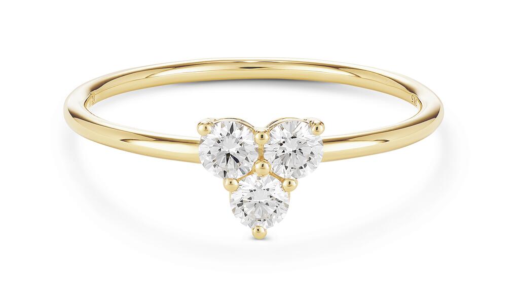 A lab-grown diamond and 14-karat yellow gold ring from Lightbox’s new “Mini Trio” collection Lightbox mini-trio collection lab-grown diamond ring in yellow gold