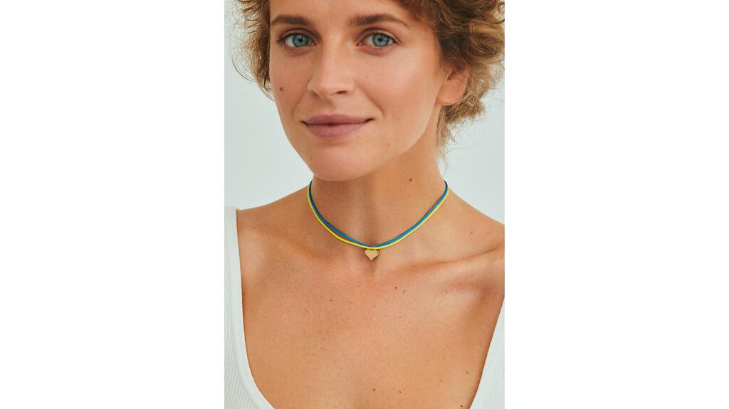 Valeriya Guzema, founder of jewelry brand Guzema, wearing the “Freedom” pendant Valeriya Guzema