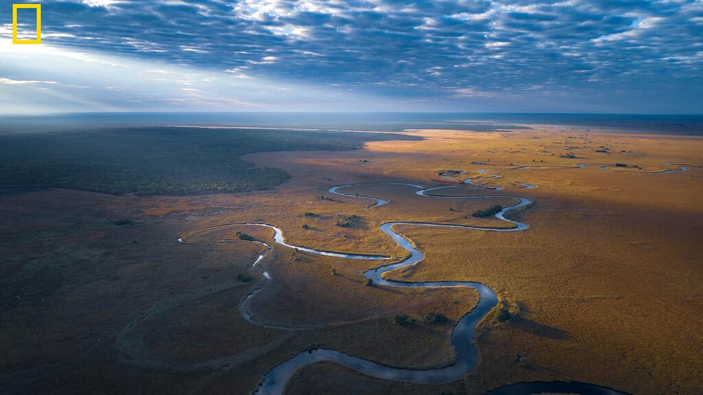 The Cuando River in Angola is one of the source rivers for the Okavango Delta. (Photo by Kostadin Luchansky/National Geographic Okavango Wilderness Project) 20240520_Cuando River.jpg