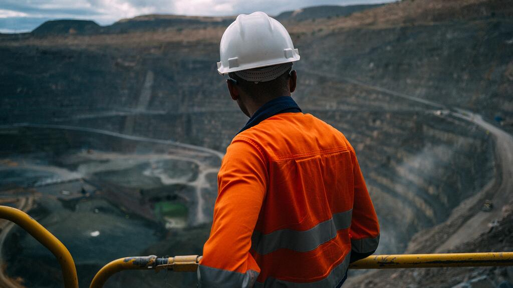 A worker looks out over the open pit at Jwaneng, Botswana’s top producer and the No. 1 diamond mine in the world in terms of value. Jwaneng churned out 13.3 million carats of diamonds in 2023, down only slightly from 2022. Worker at Botswana’s Jwaneng diamond mine