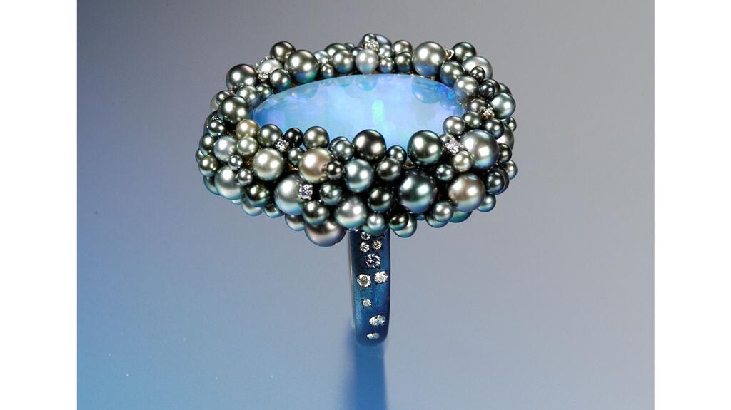 This Sean Gilson ring crafted of natural pearls, opal, diamonds and blued steel took three years to create. Sean Gilson natural pearl, opal, diamonds and blued steel ring