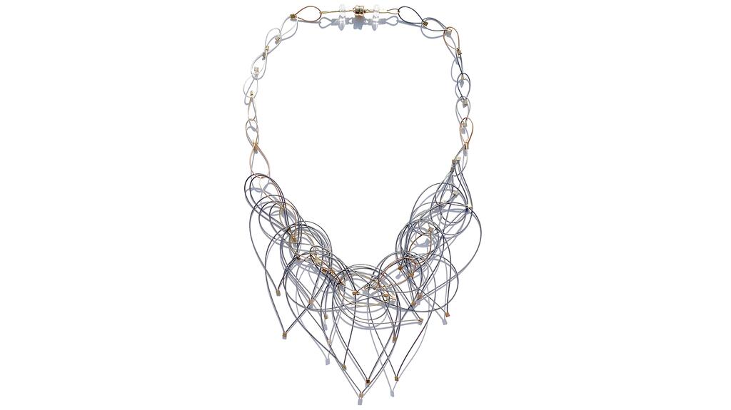 Meghan Patrice Riley of MPR Jewelry crafts her jewelry using industrial, nylon-coated stainless steel cable wire, as well as fine metals, and other materials. MPR Jewelry necklace