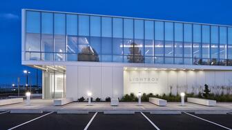 The exterior of De Beers Group’s diamond factory in Gresham, Oregon. The company announced last week that it is transitioning production at the facility from diamonds for jewelry to diamonds for industrial and technology uses. CEO Al Cook said the exterior of the factory, which currently reads “Lightbox,” will eventually be rebranded. Exterior Lightbox diamond factory Gresham, Oregon