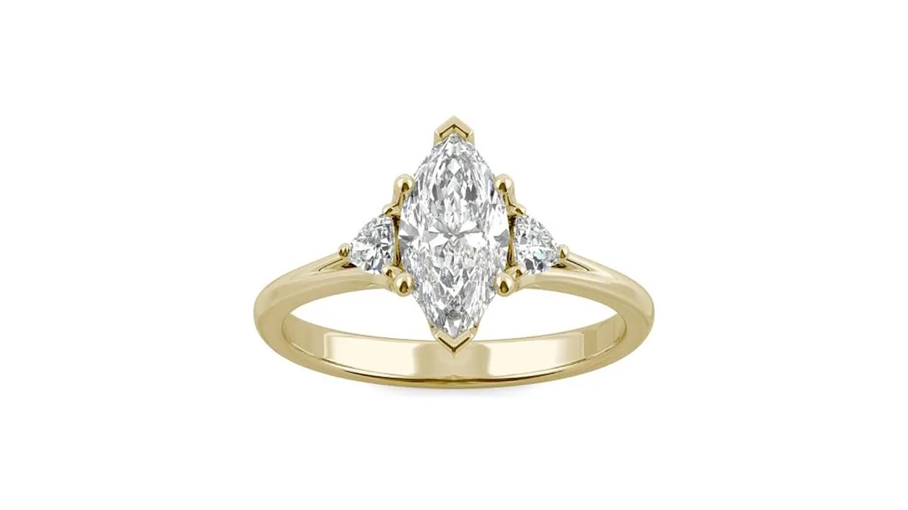 A 1.18-carat marquise “Forever One” moissanite three-stone ring in 14-karat yellow gold by Charles & Colvard. The company has teamed up with the International Gemological Institute to provide grading reports for its moissanite. Charles & Colvard moissanite ring