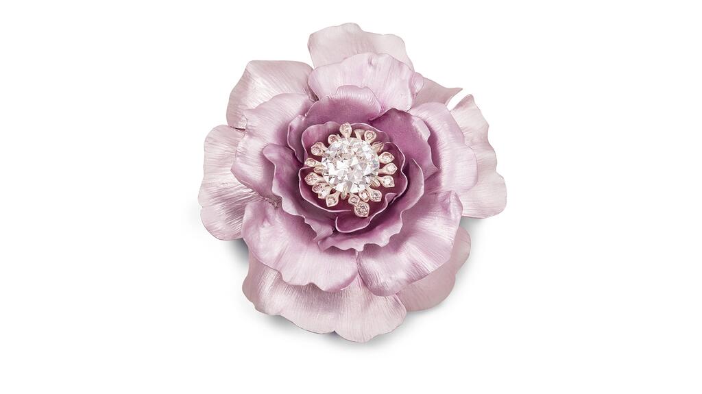 The “Rose” brooch from Hemmerle’s “Infused Jewels” collection is crafted in aluminum and white gold with diamonds. Hemmerle Rose brooch