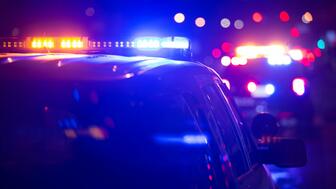 The Belmont Police Department in North Carolina is looking for four suspects connected to the robbery, shooting, and kidnapping of a jeweler Wednesday night. Stock image of police car with lights on