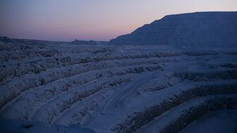 The sun sets over the open pit of De Beers’ Gahcho Kué diamond mine in Canada. In operation since 2016, it is one of the world’s newest diamond mines and one of the main reasons global diamond production spiked in 2017. (Photo credit: Ben Perry/Armoury Films, ©De Beers Group) 20220523_Gahcho Kue mine.jpg