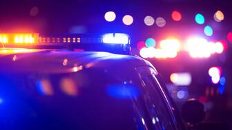 Police are on the lookout for the man and woman who broke into a California jewelry store earlier this month and fled with the store’s safe trailing from their van. Stock image of police cars with their lights on