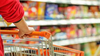 The Conference Board’s consumer confidence index fell to 103 in September from 108.7 in August. Hands pushing a shopping cart