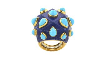David Webb’s “Sputnik” ring features lapis with pear-shaped turquoise cabochons bezel-set in 18-karat gold ($38,500). David Webb turquoise and lapis ring