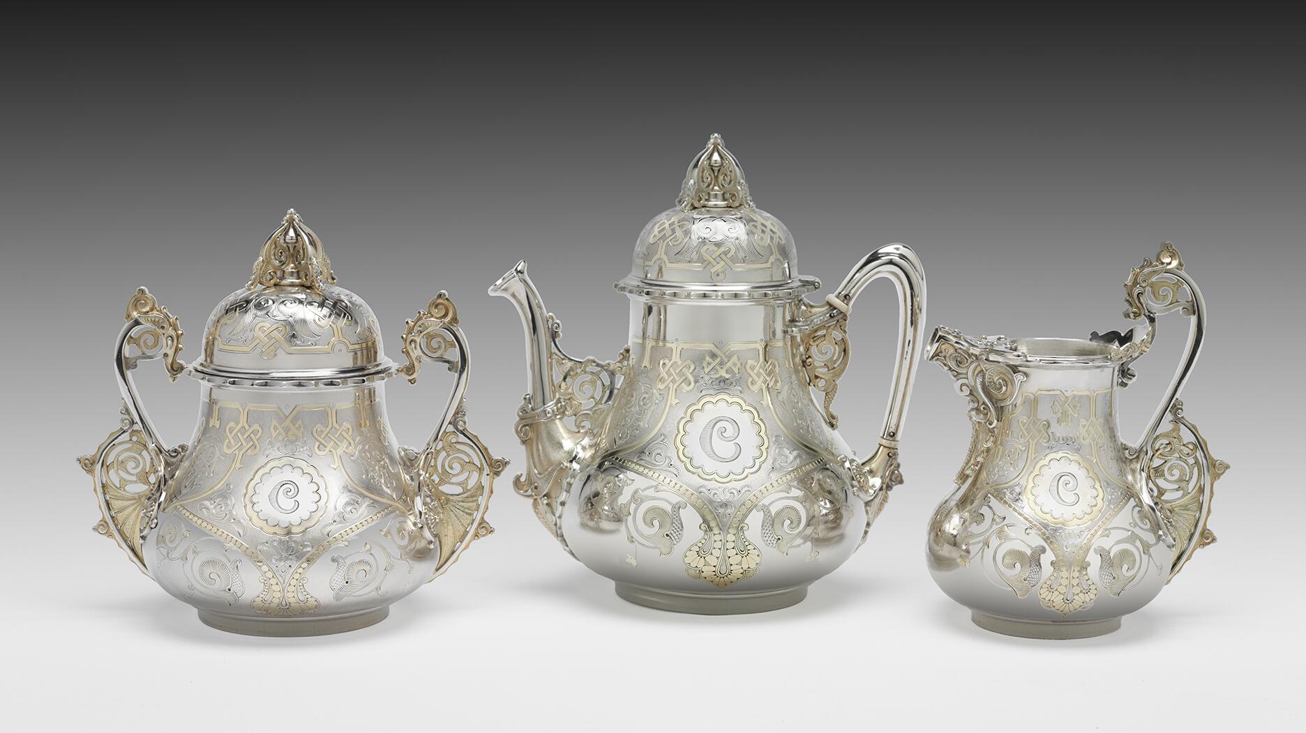 Crafted in 1866-1867, this silver, silver gilt, and ivory tea set is described in Tiffany & Co. records as “Moresque.” It served as an early example of the influence Persian designs had on longtime Tiffany & Co. silversmith Edward C. Moore. A collection of objects belonging to Moore is currently on display at The Metropolitan Museum of Art in New York. (© The Metropolitan Museum of Art, 2024) Tiffany & Co. silver tea set