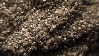 Rough diamonds from De Beers’ Gahcho Kue diamond mine in Canada. The company’s most recent round of rough diamond sales brought in $315 million, down by double-digits both year-over-year and cycle-to-cycle. (©De Beers Group/Photo credit: Ben Perry @ Armoury Films) Stock image of rough diamonds from De Beers Gahcho Kue diamond mine