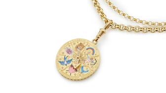 The 18-karat yellow gold medallion features hand-painted champlevé enamel picturing seven symbols from the “Insignia” collection and brilliant-cut diamonds ($51,000). Cece Jewellery Insignia Medallion