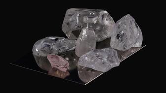 Lucapa sold a 14-carat pink diamond (pictured lower left) and five white diamonds from the Lulo alluvial mine in Angola in its second tender of the year. Lulo tender 14 carat pink diamond