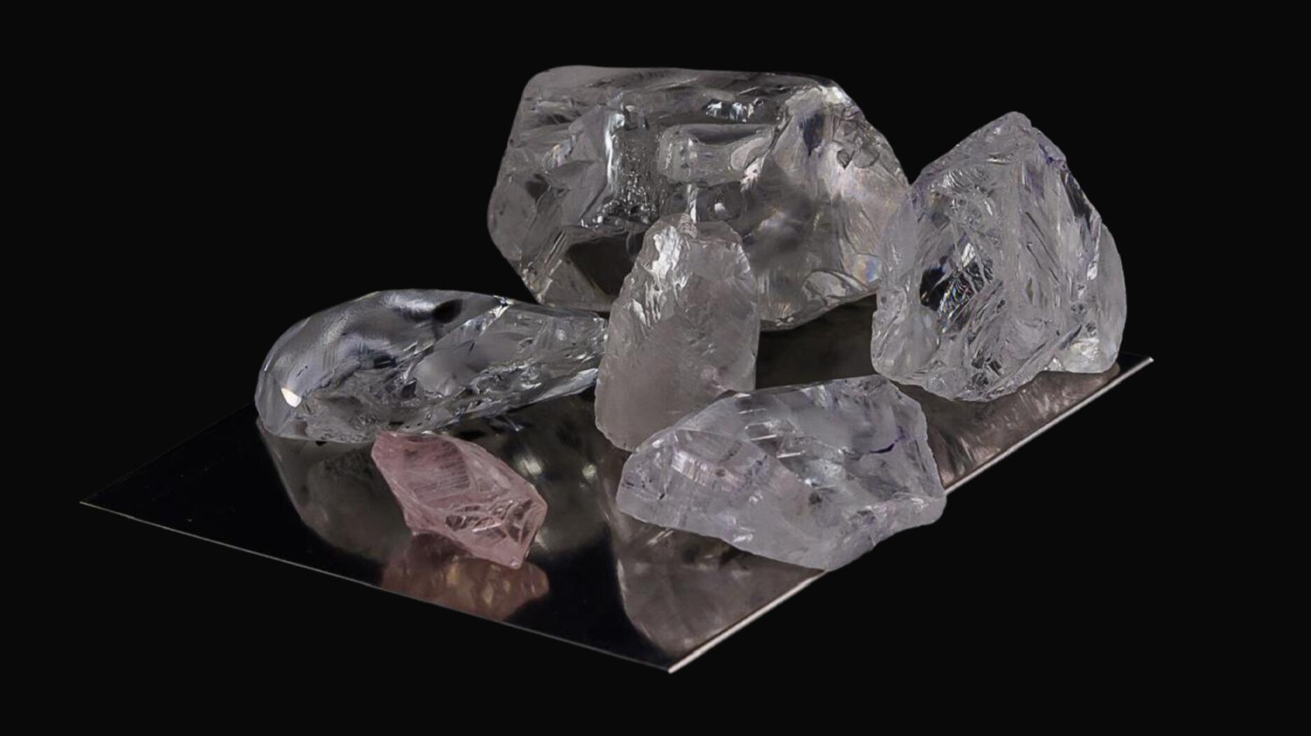 Lucapa sold a 14-carat pink diamond (pictured lower left) and five white diamonds from the Lulo alluvial mine in Angola in its second tender of the year. Lulo tender 14 carat pink diamond